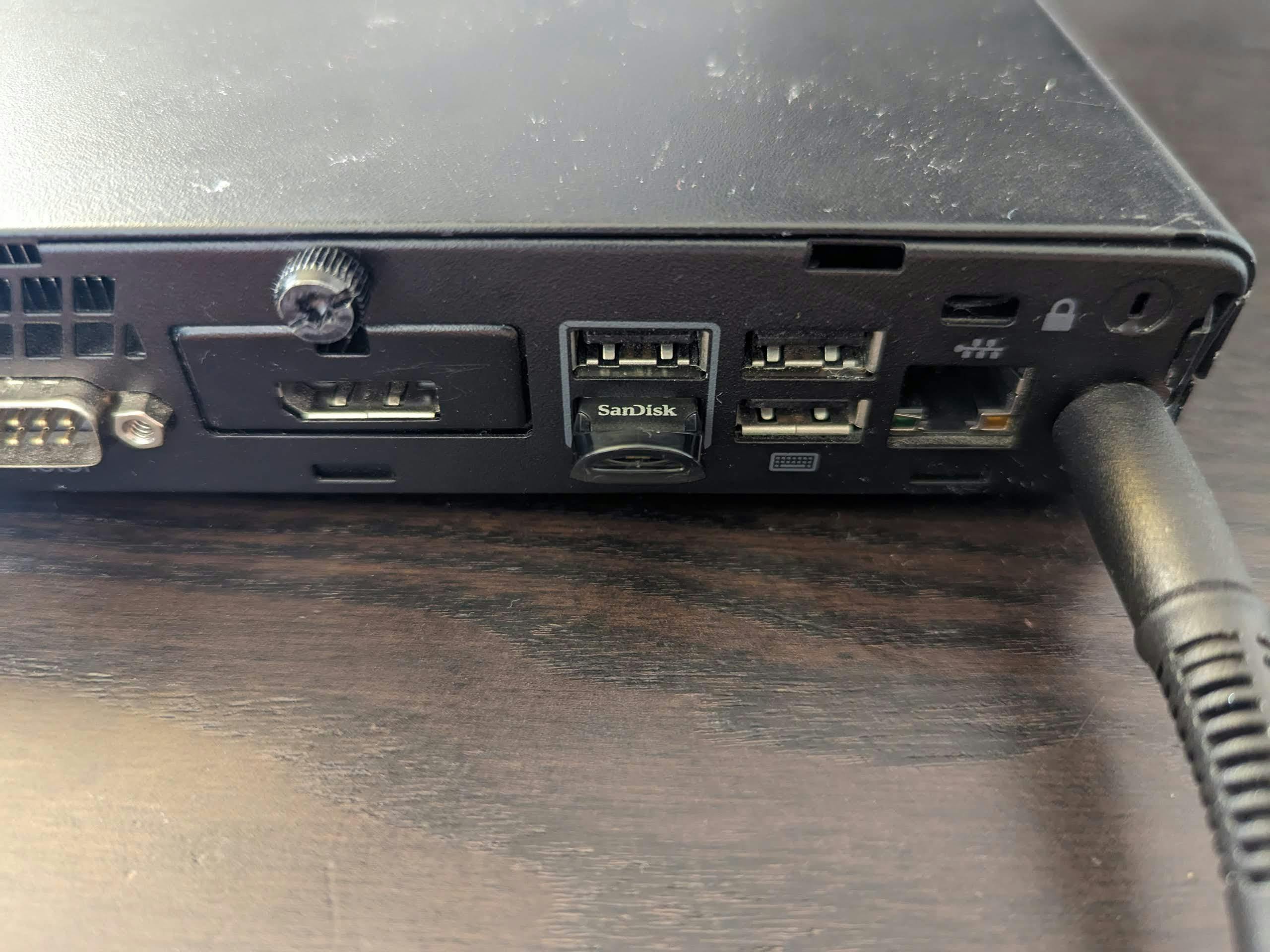 Tiny flash drive plugged in a USB port